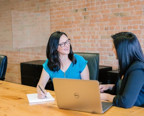 two women discussing Updates to the ICF Core Competencies