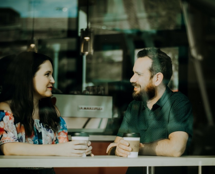 man woman sitting in cafe mental health first aid