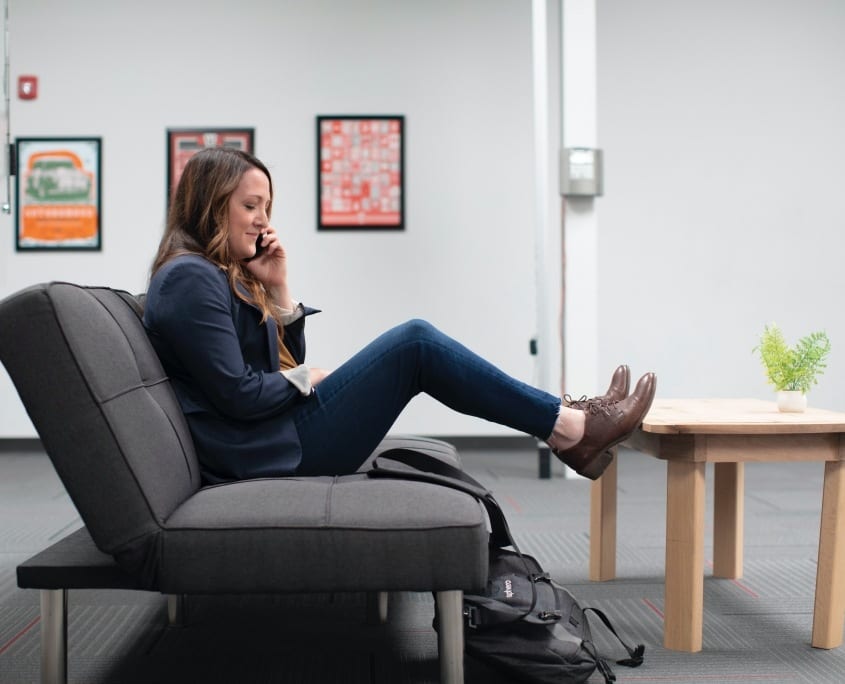 lady on phone on coach feet up linkedin-sales-navigator-FCr_Oglkth0-unsplash lady sitting on couch mental health