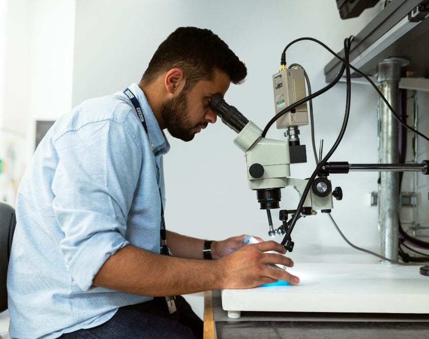 Man looking into microscope thisisengineering-raeng-WsYamymQIxk-unsplash strong decisions
