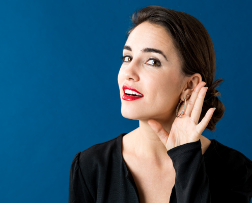 Active listening, woman with hand to ear